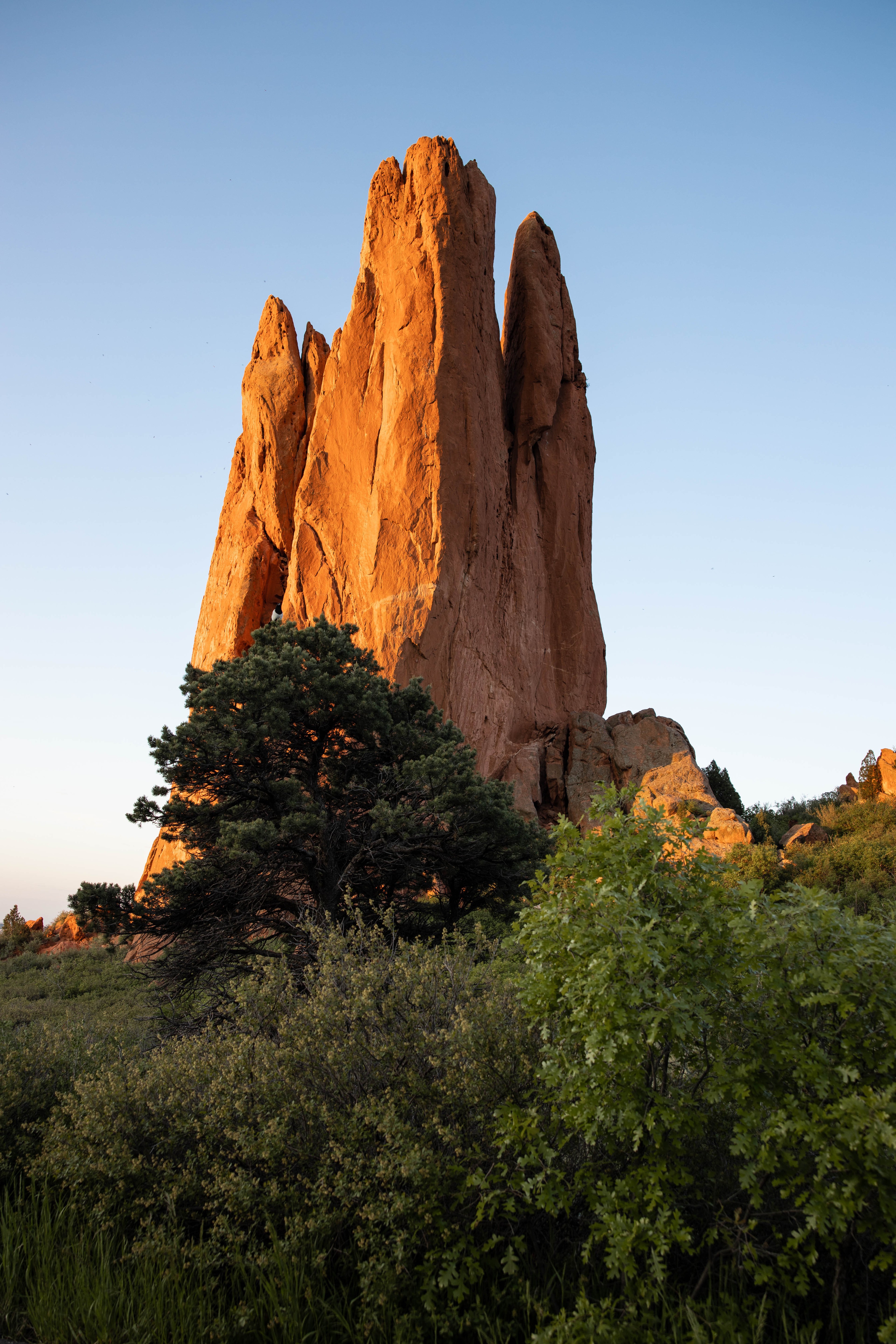 the spires catch the first sun. red stone glowing.
